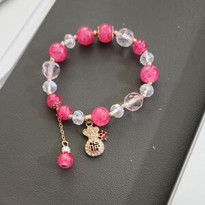 Elegant Pink and Gold Charm Bracelet